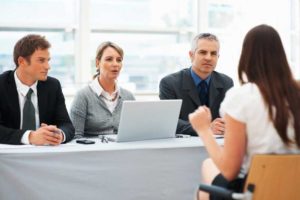 Woman being interviewed by a panel