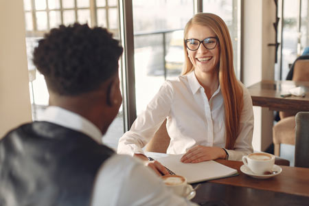 Recruiter and candidate meet over coffee